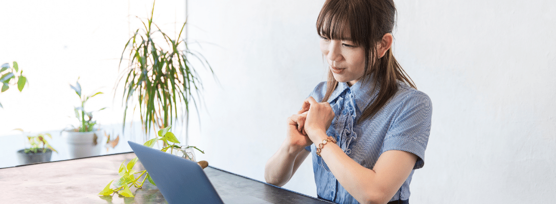 woman explaining on laptop in businesswear interview